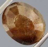 UNTREATED! Shimmering 9.10ct earth toned faceted Sapphire