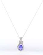 Attractive White Gold Tanzanite and Diamond Halo Pendant on Chain