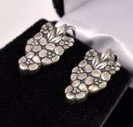 Flower Clip On Earrings In Sterling Silver