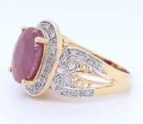 Charming Yellow Gold Oval Ruby and Diamond Halo Ring