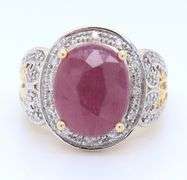 Charming Yellow Gold Oval Ruby and Diamond Halo Ring