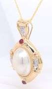 Wonderful Yellow Gold oval Mabe Pearl Enhancer with Ruby Cab and Diamond accents Necklace
