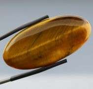 Full body shimmer! 49.27ct Golden Tiger Eye cabochon