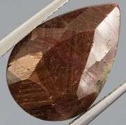 Shimmering metallic 10.84ct earth toned faceted Sapphire
