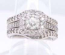 Elegant White Gold Round Brilliant Cut Diamond and Halo Wedding Set