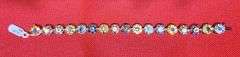 LADIES 14K YELLOW GOLD RAINBOW BRACELET WEIGHING A TOTAL OF 25.00 CARATS