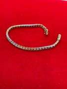 CERTIFIED 14K WHITE AND YELLOW GOLD DIAMOND TENNIS BRACELET. 1.25 CARAT