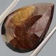 Shimmering metallic 10.84ct earth toned faceted Sapphire