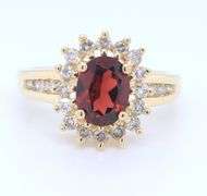 Stunning Yellow Gold Oval Garnet and Diamond Halo Ring