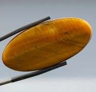 Full body shimmer! 49.27ct Golden Tiger Eye cabochon