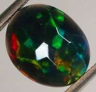Glittering multi pattern flashing 1.43ct Welo black Opal
