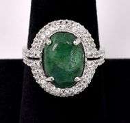 Brilliant 6.50CTS Oval Shaped Cabochon-Cut Emerald & 1.50CTW White Sapphire Ring in Sterling Silver