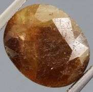 UNTREATED! Shimmering 9.10ct earth toned faceted Sapphire