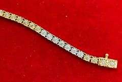 CERTIFIED 14K WHITE AND YELLOW GOLD DIAMOND TENNIS BRACELET. 1.25 CARAT