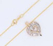 Attractive Yellow Gold Round Brilliant Cut and Baguette Open Diamond Heart Pendant on Chain