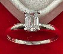 CERTIFIED BRAND NEW 14K WHITE GOLD SOLITAIRE RING . 0.67 CARAT.