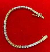 CERTIFIED 14K WHITE AND YELLOW GOLD DIAMOND TENNIS BRACELET. 1.25 CARAT