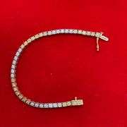 CERTIFIED 14K WHITE AND YELLOW GOLD DIAMOND TENNIS BRACELET. 1.25 CARAT