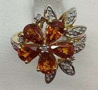 LADIES 10K YELLOW GOLD DIAMOND AND GARNET RING