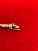 CERTIFIED 14K WHITE AND YELLOW GOLD DIAMOND TENNIS BRACELET. 1.25 CARAT