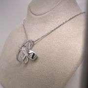 14K WHITE GOLD CHARM NECKLACE WITH DIAMONDS