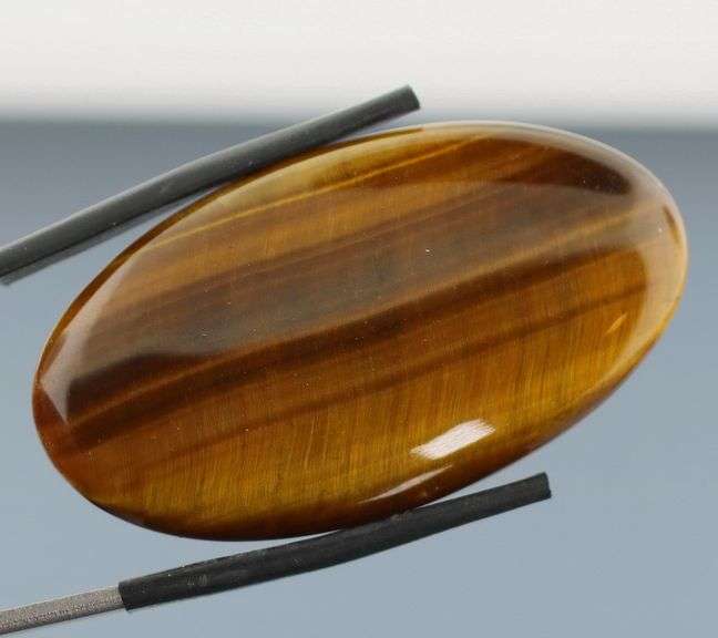 Full body shimmer! 50.03ct Golden Tiger Eye cabochon