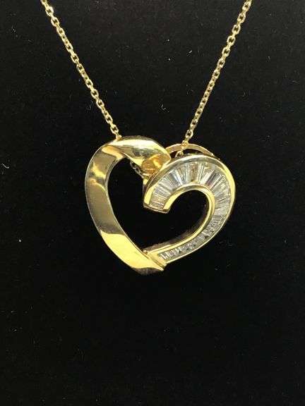 A SYMBOL OF LOVE 14K YELLOW GOLD BAGUETTE CUT DIAMOND PENDANT NECKLACE