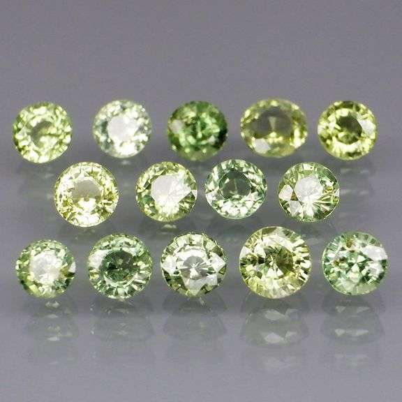 Fantastic 4.82ct diamond cut GREEN Sapphire set