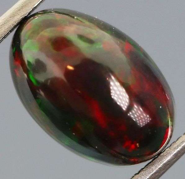 Magnificent 2.37ct full body flashing Black Opal