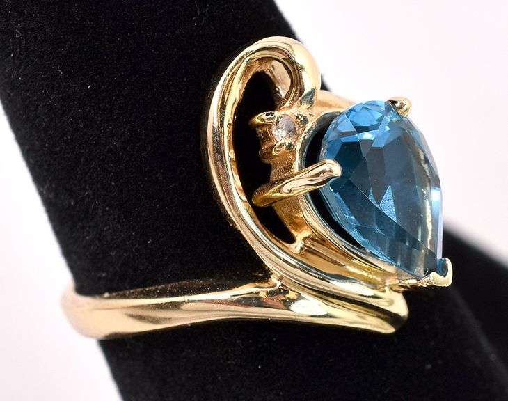Pretty Blue Topaz And Diamond Ring In 14K Yellow Gold