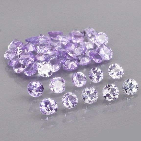 Heavy flashing 4.25ct diamond cut Tanzanite set
