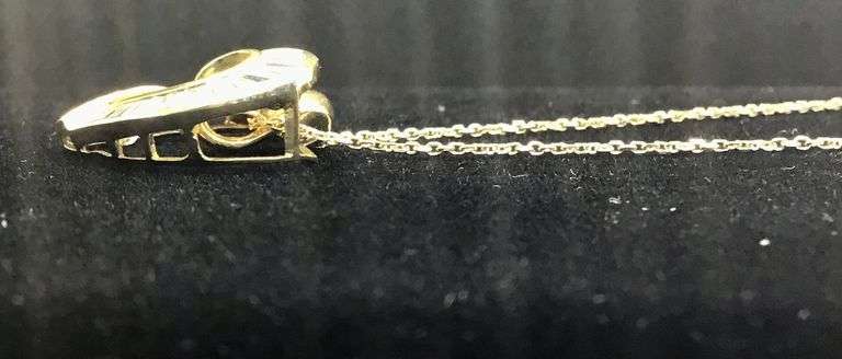 A SYMBOL OF LOVE 14K YELLOW GOLD BAGUETTE CUT DIAMOND PENDANT NECKLACE