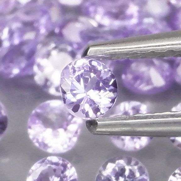 Heavy flashing 4.25ct diamond cut Tanzanite set