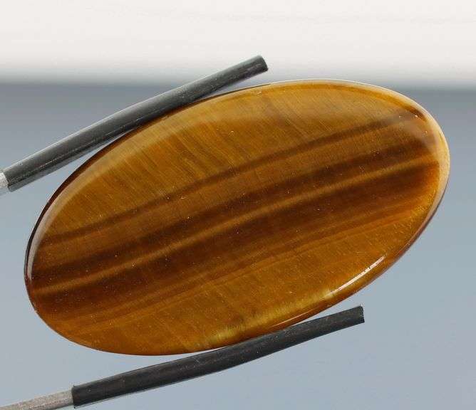 Full body shimmer! 50.03ct Golden Tiger Eye cabochon