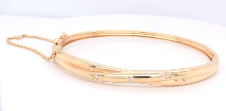 Attractive Diamond Accent Bezel Set Crossover Bangle Bracelet in 14kt Yellow Gold