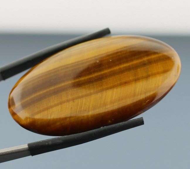 Full body shimmer! 50.03ct Golden Tiger Eye cabochon
