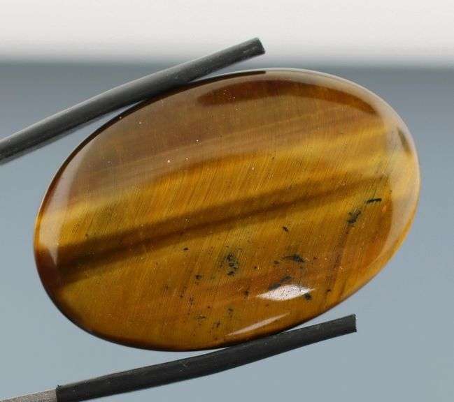Dramatic 44.26ct Tiger Eye cabochon
