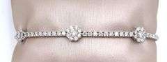 4 CARAT! DIAMOND TENNIS BRACELET WITH 3 DIAMOND FLOWERS