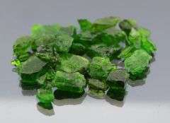 Rich forest green 50ct rough Chrome Diopside set