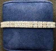 CLASSIC AND GORGEOUS 14K WHITE GOLD BAGUETTE AND ROUND BRILLIANT CUT DIAMOND TENNIS BRACELET