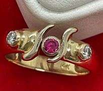 LADIES 14K GOLD DIAMOND AND RUBY RING.