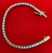 CERTIFIED 14K WHITE AND YELLOW GOLD DIAMOND TENNIS BRACELET. 1.25 CARAT