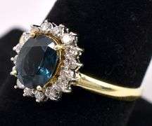 Elegant Enhanced Blue Sapphire And Diamond Ring In 14K Yellow Gold