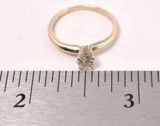 Elegant Solitaire Diamond Ring In 14K Yellow Gold