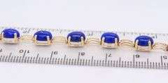 Attractive Yellow Gold Oval Lapis and Greek Key Station Bracelet