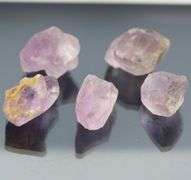Collectors untreated 257.97ct uncut Amethyst set
