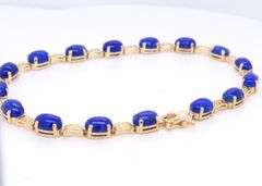 Attractive Yellow Gold Oval Lapis and Greek Key Station Bracelet