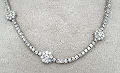 9CARAT! DIAMOND NECKLACE WITH 7 FLOWERS