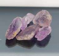 Collectors untreated 268.14ct uncut Amethyst set