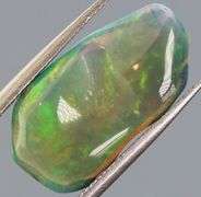 High fire collectors 3.53ct free form black Opal vein